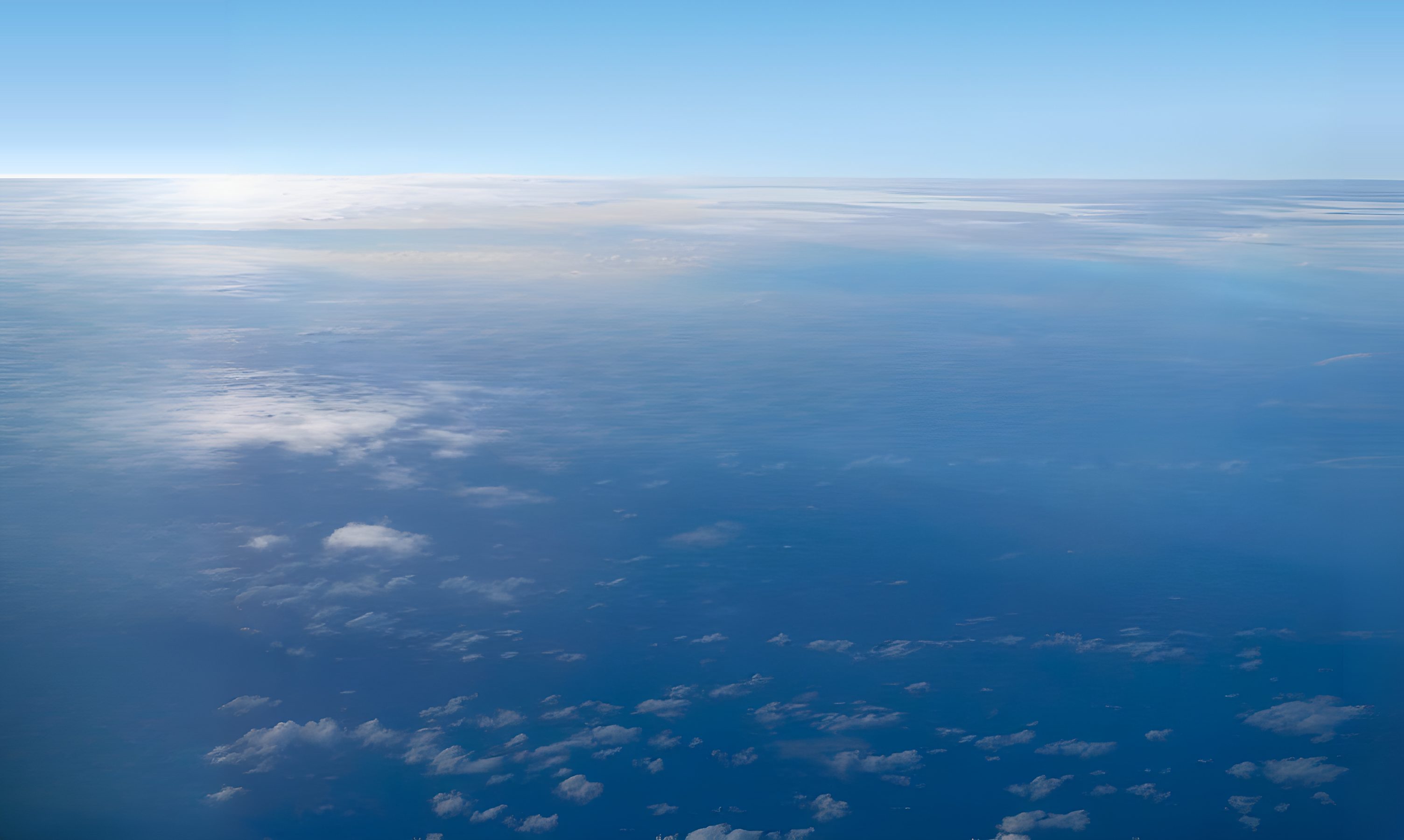 Cargo aircraft in flight above the clouds